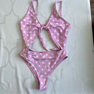 Dolls Kill Sugar Thrillz Walk the Line pink polka dot cutout one piece swimsuit
